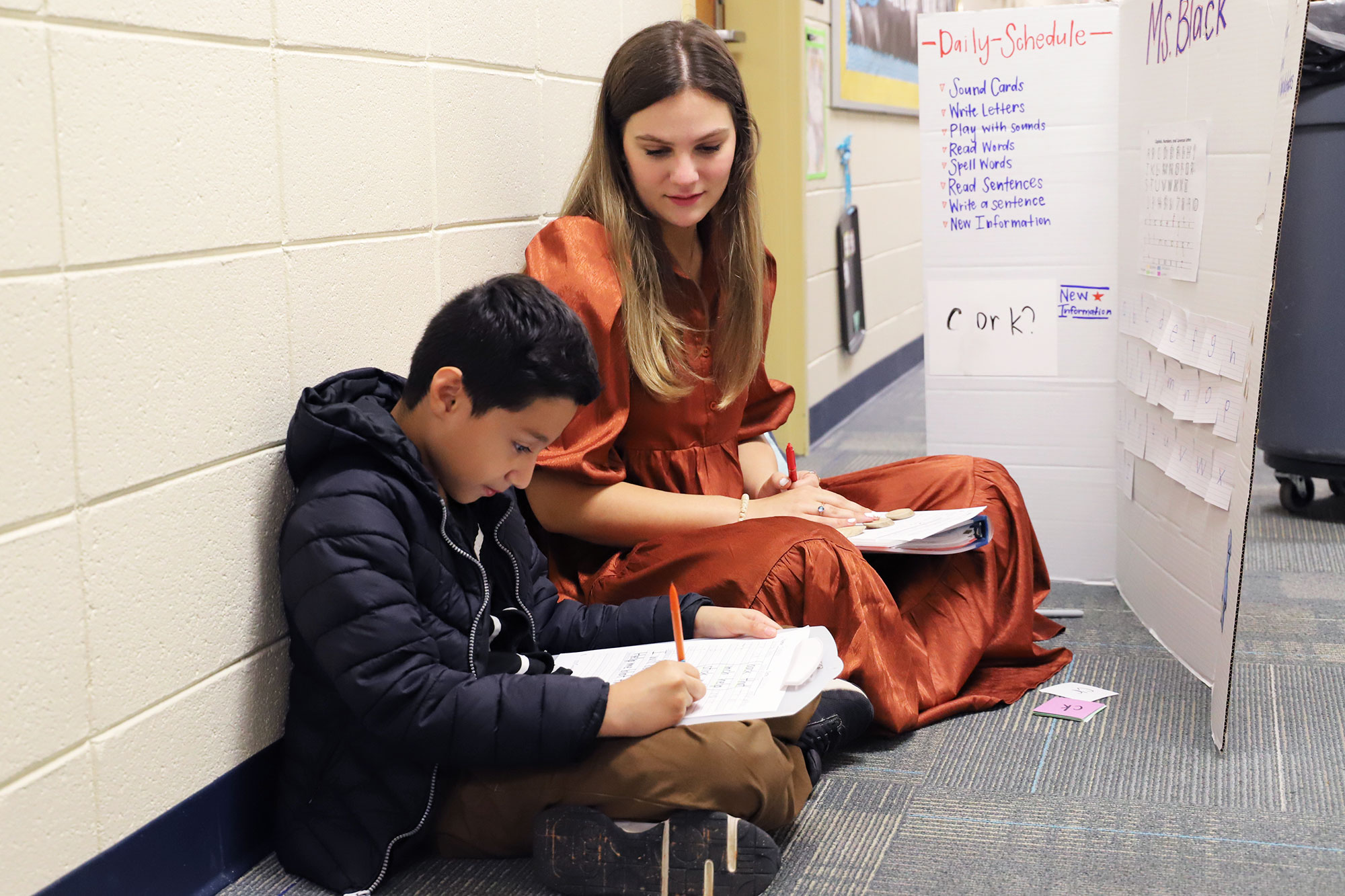 student teacher working with a first-grader